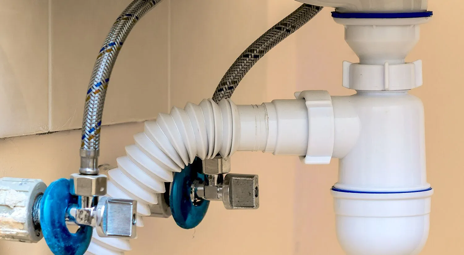 Stainless steel braided flexi hoses under a laundry sink